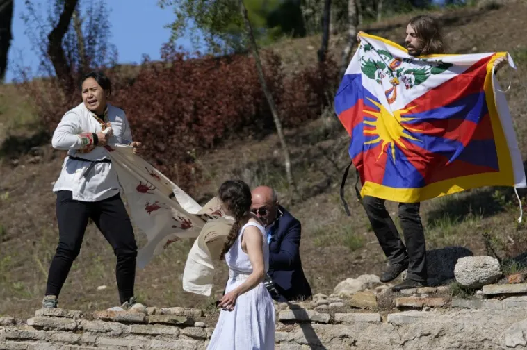 Protesters disrupt flame-lighting for Beijing Winter Olympics