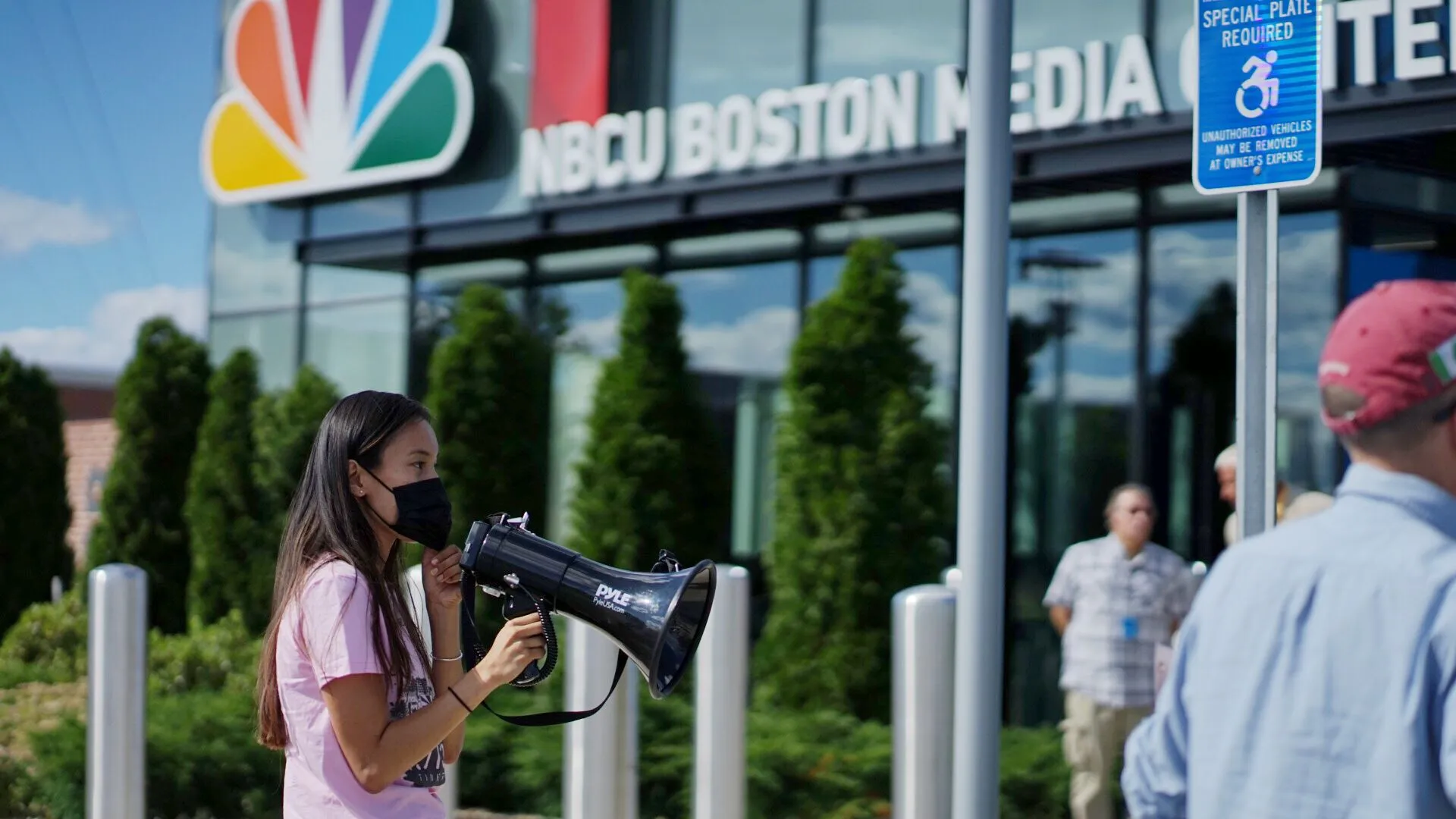 ACTIVISTS PROTEST AT NBC HEADQUARTERS IN BOSTON OVER BROADCASTER’S PLAN TO AIR CHINA’S ‘GENOCIDE GAMES’
