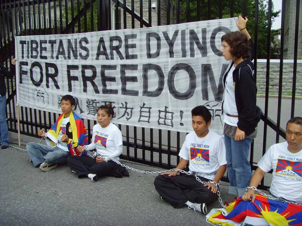 SFT Activists chained to the gate of the Chinese embassy in Ottawa ahead of the 2008 Beijing Olympics.